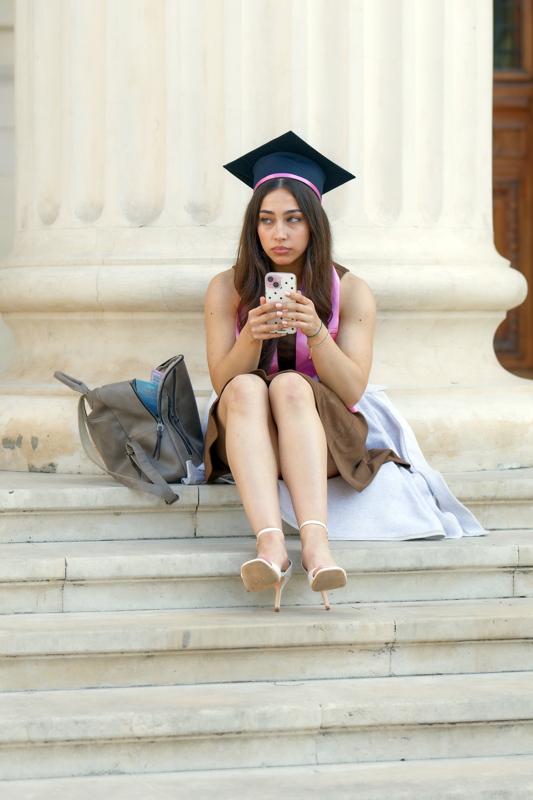 Graduate girl wearing a two-toned minimal tailoring top